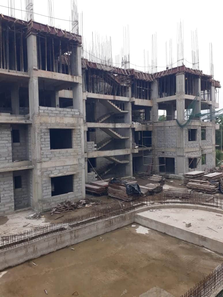 a building under construction with a few stairs