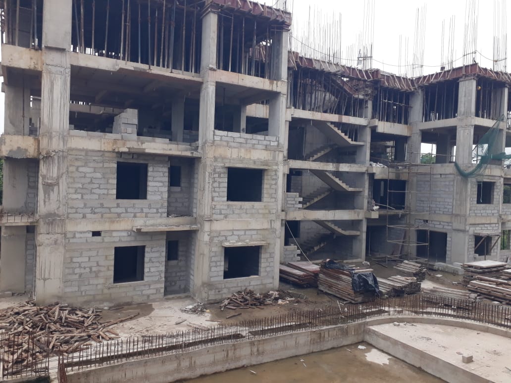a building under construction with a few stairs